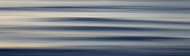 Swell lines approach the shore at sunset