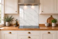 Pearl Grey Marble Effect Glass Splashback as a hob-width panel in a white shaker kitchen