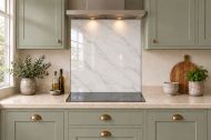 Pearl Grey Marble Effect Glass Splashback as a hob-width panel in a sage shaker kitchen
