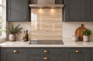 Warm Beige Travertine Effect Glass Splashback as a hob-width panel in a charcoal shaker kitchen