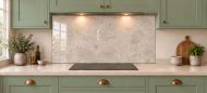 Soft Greige Limestone Effect Glass Splashback as a wide panel under the cooker hood in a sage shaker kitchen