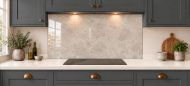Soft Greige Limestone Effect Glass Splashback as a wide panel under the cooker hood in a charcoal shaker kitchen