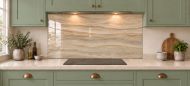 Sandstone Ripple Effect Glass Splashback as a wide panel under the cooker hood in a sage shaker kitchen
