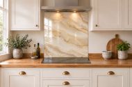 Ivory Onyx Effect Glass Splashback as a hob-width panel in a white shaker kitchen