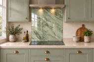 Sage Green Marble Effect Glass Splashback as a hob-width panel in a sage shaker kitchen