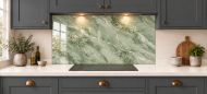 Sage Green Marble Effect Glass Splashback as a wide panel under the cooker hood in a charcoal shaker kitchen
