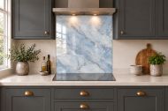 Mist Blue Marble Effect Glass Splashback as a hob-width panel in a charcoal shaker kitchen