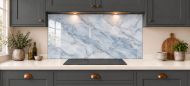 Mist Blue Marble Effect Glass Splashback as a wide panel under the cooker hood in a charcoal shaker kitchen