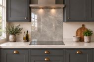 Warm Grey Concrete Effect Glass Splashback as a hob-width panel in a charcoal shaker kitchen