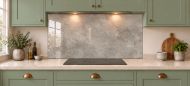 Warm Grey Concrete Effect Glass Splashback as a wide panel under the cooker hood in a sage shaker kitchen