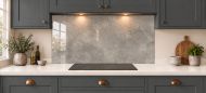 Warm Grey Concrete Effect Glass Splashback as a wide panel under the cooker hood in a charcoal shaker kitchen