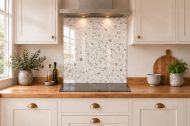 Ivory Terrazzo Effect Glass Splashback as a hob-width panel in a white shaker kitchen