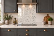 Ivory Terrazzo Effect Glass Splashback as a hob-width panel in a charcoal shaker kitchen