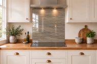 Taupe Slate Effect Glass Splashback as a hob-width panel in a white shaker kitchen