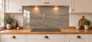 Taupe Slate Effect Glass Splashback as a wide panel under the cooker hood in a white shaker kitchen