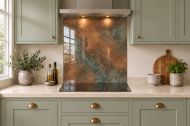 Soft Copper Patina Effect Glass Splashback as a hob-width panel in a sage shaker kitchen